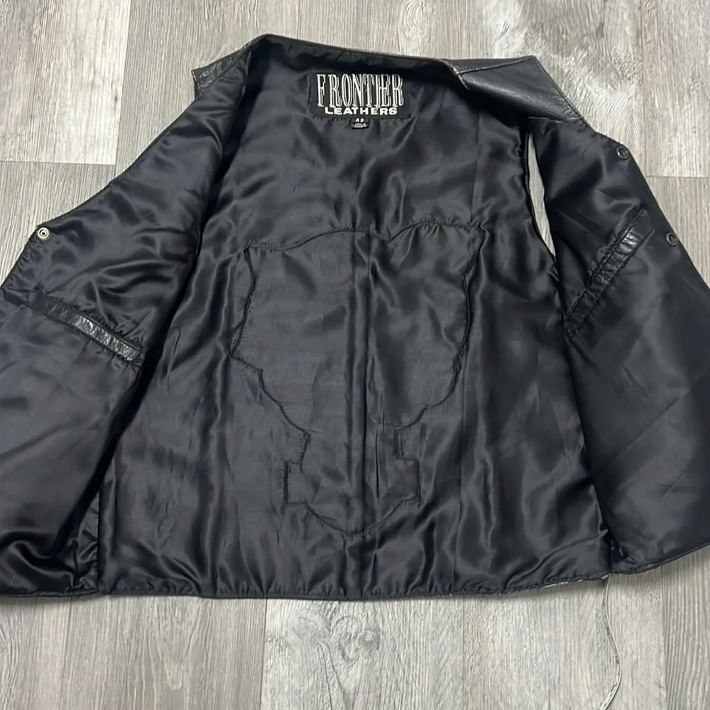 Frontier Leather Men’s Vest w/ the “Harley Davidson” patch on the back. Size 42